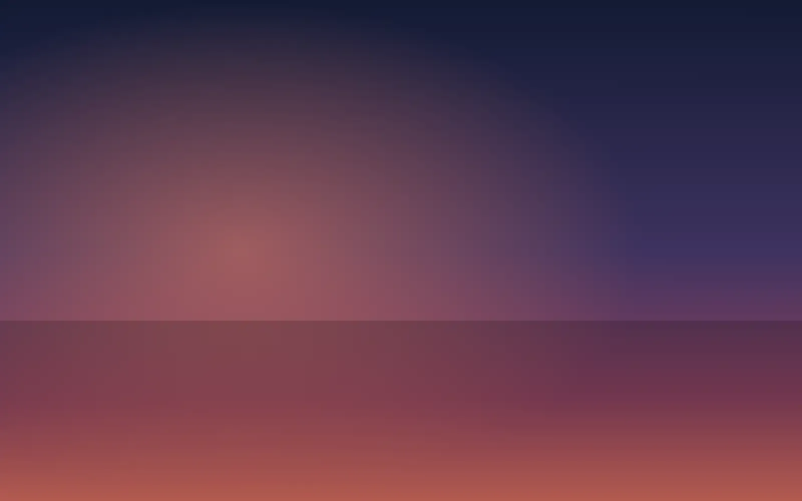 Dusk glow over a darkening coastline